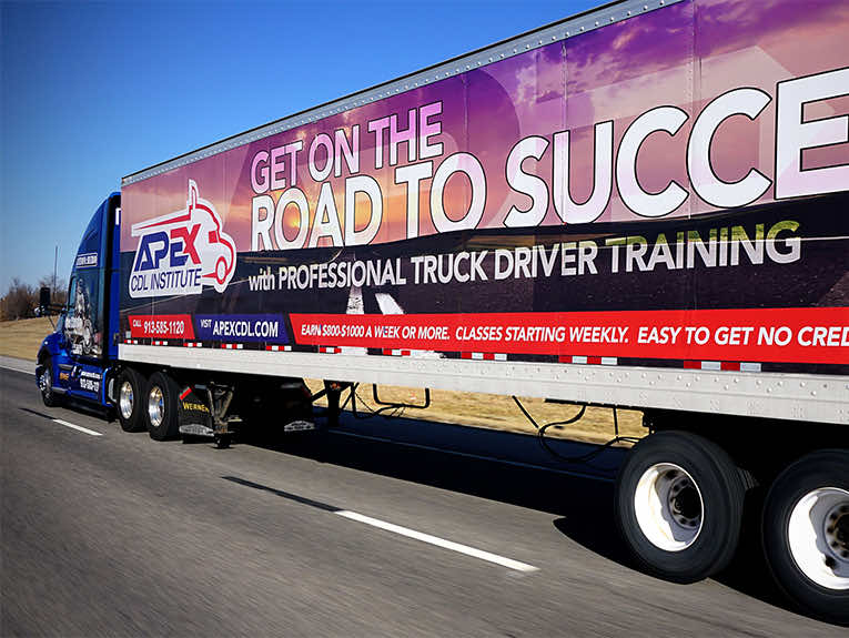 image of Apex truck and trailer driving on road