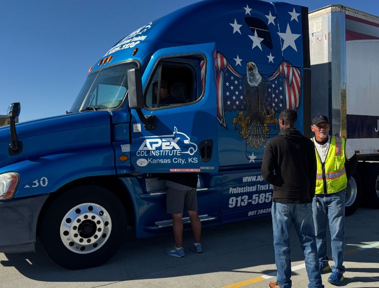 cdl students and instructor outside of apex branded semi cab
