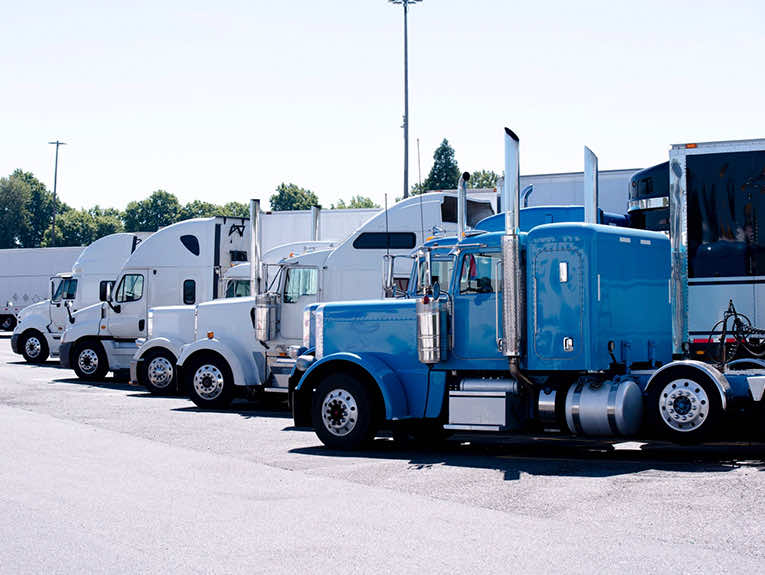 image of semi trucks parked in a row