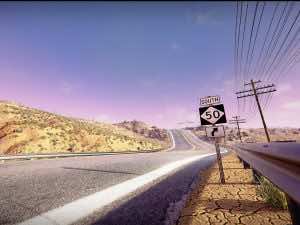 highway sign on in front of sunset