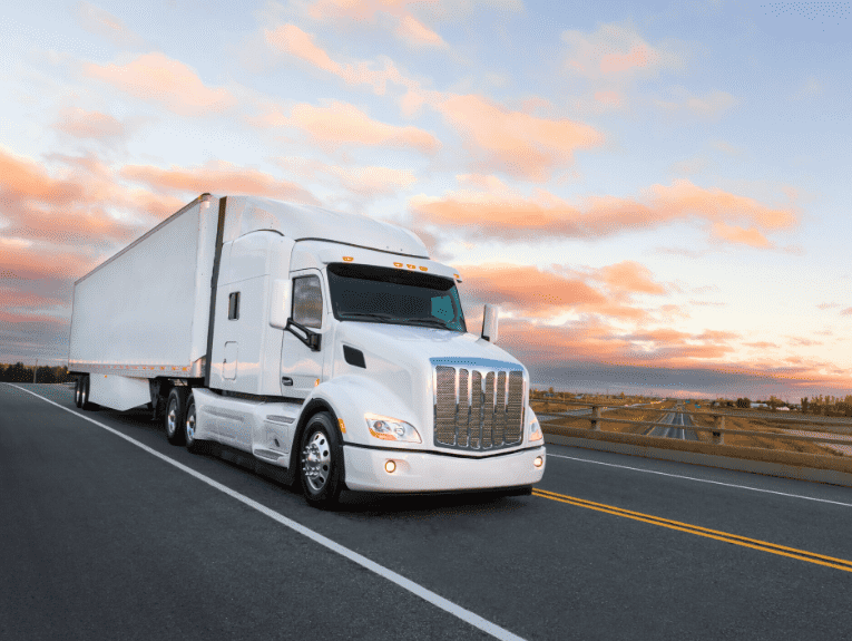 image of white semi semi driving on road