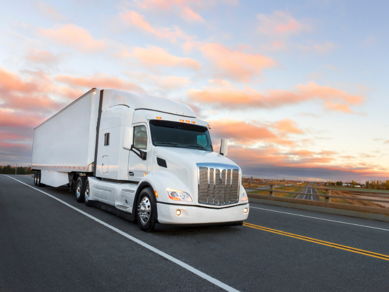 image of white truck in front of sunset