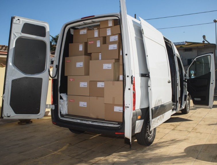 Delivery van with a full bed of packages