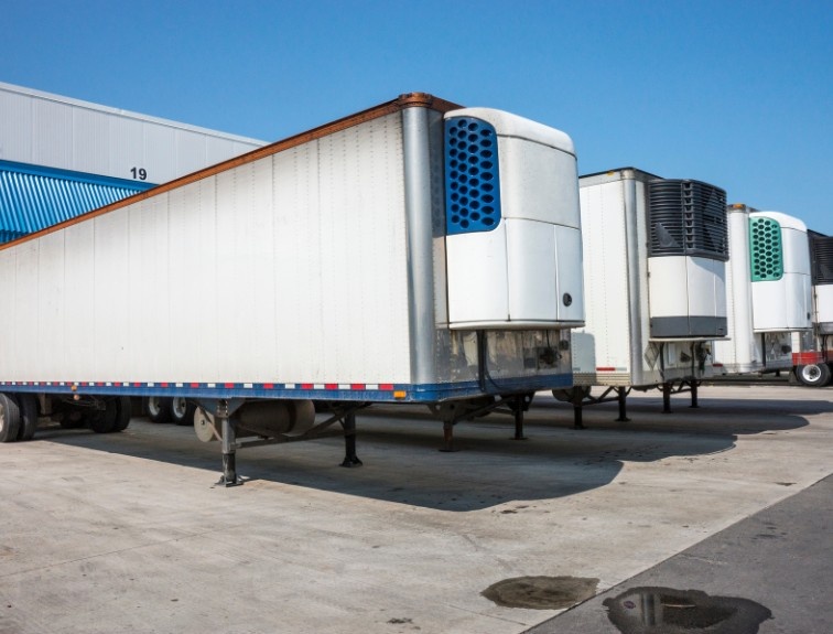 Reefer trailers parked at a warehouse