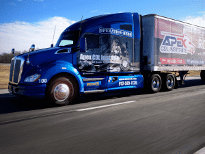large blue semi truck with Apex branding