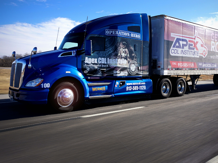 image of large blue semi truck with Apex branding