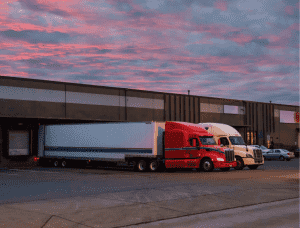 red semi truck in loading dock