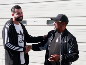 Mohamad Aly and Ricky Taylor shake hands