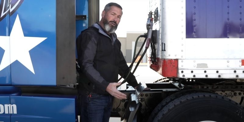 Jeff Steinberg, Apex CEO, inspecting drivers side in CDL pre-trip inspection