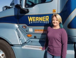 Apex student standing in front of her Werner truck