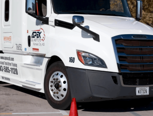 Closeup of a white Apex semi truck